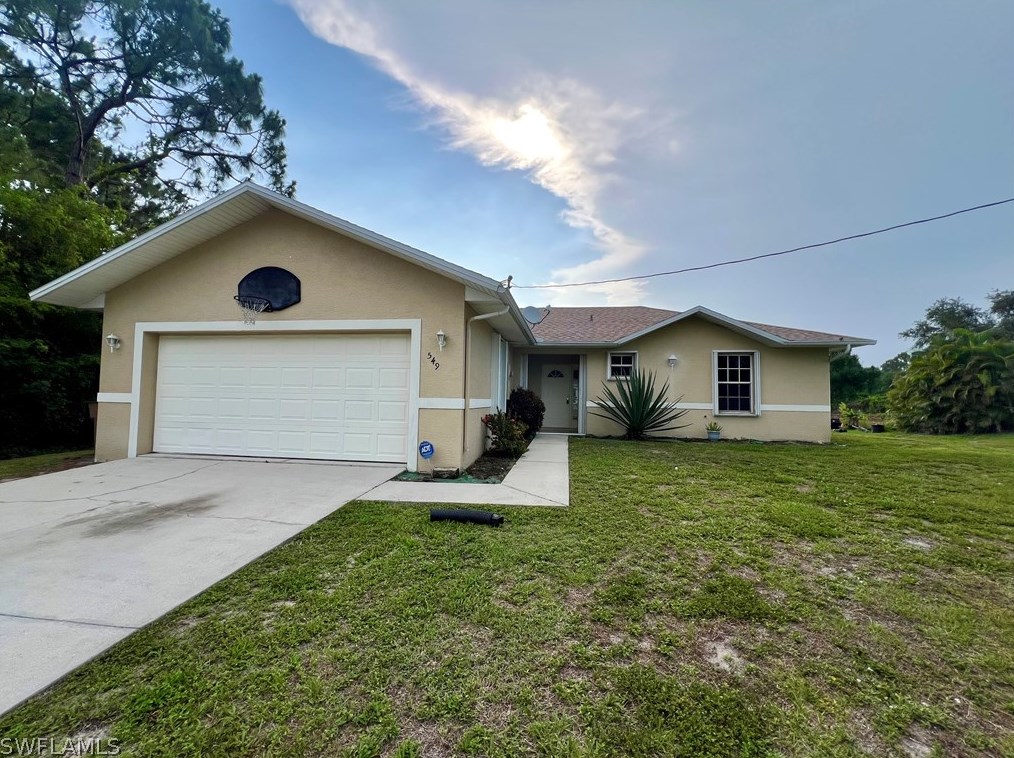 549 Genoa Ave, Lehigh Acres, FL 33974-2611