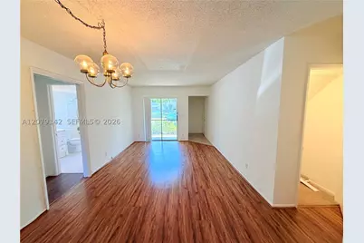 107 Gardens #106, Pompano Beach, FL 33069 - Photo 2
