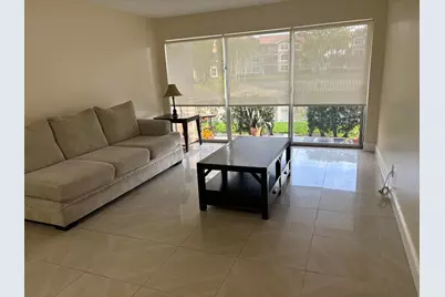 9033 Wiles Road #102, Coral Springs, FL 33067 - Photo 2