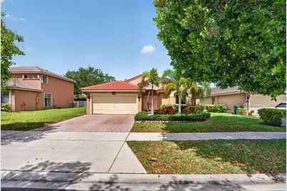 4677 Saint Simon Drive, Coconut Creek, FL 33073 - Photo 1