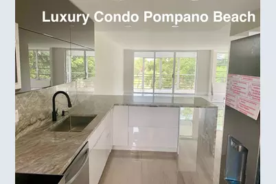 3960 Oaks Clubhouse Drive #401, Pompano Beach, FL 33069 - Photo 2