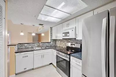 5011 Wiles Road #303, Coconut Creek, FL 33073 - Photo 1