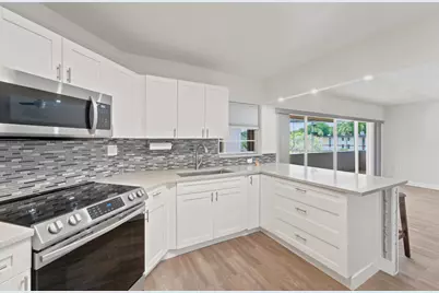 4 Greenway Village N #203, Royal Palm Beach, FL 33411 - Photo 1