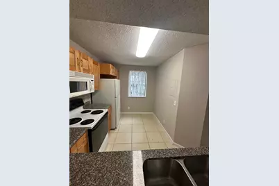 9001 Wiles Road #101, Coral Springs, FL 33067 - Photo 6