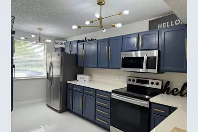 8891 Wiles Road #208, Pompano Beach, FL 33067 - Photo 4