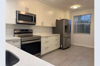 9055 Wiles Road #307, Coral Springs, FL 33067 - Photo 8