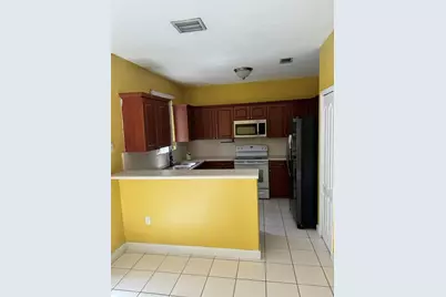 7357 NW 174 #102, Hialeah, FL 33015 - Photo 1