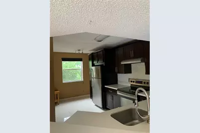 8891 Wiles Road #308, Pompano Beach, FL 33067 - Photo 1