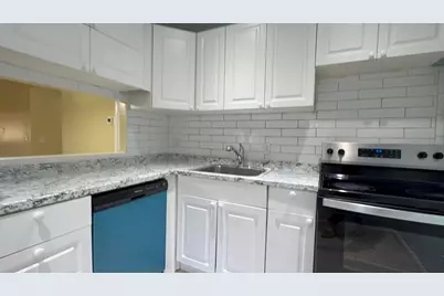12009 Poinciana Boulevard #202, Royal Palm Beach, FL 33411 - Photo 1