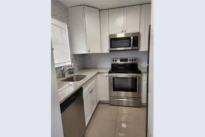 9911 Sandalfoot Boulevard #101, Boca Raton, FL 33428 - Photo 1