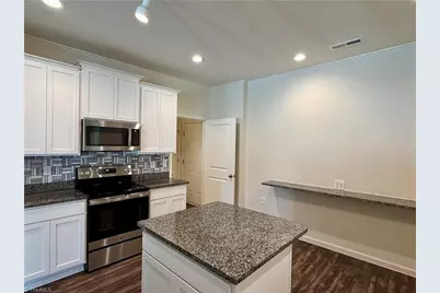 6548 Donahue Drive, Whitsett, NC 27377 - Photo 6