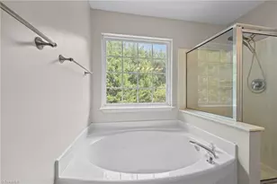 693 Triple Crown Ct, Whitsett, NC 27377 - Photo 18