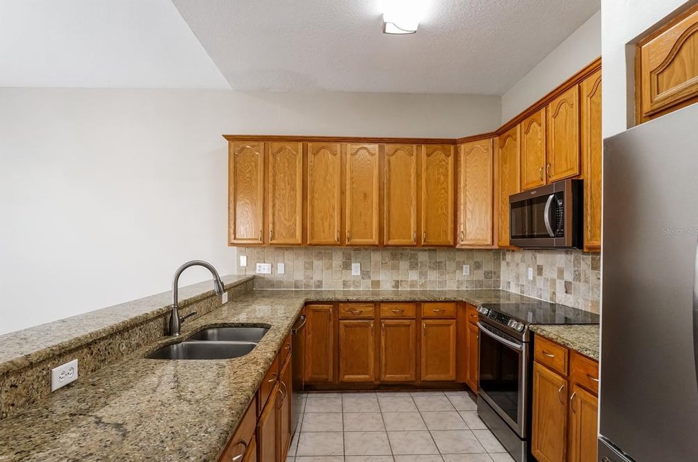 14332 Tambourine Dr, Orlando, FL 32837-7038