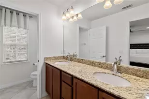 8681 Lower Villagewalk Cir, Orlando, FL 32827 - Photo 48