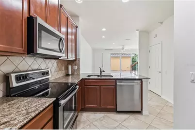 8681 Lower Villagewalk Circle, Orlando, FL 32827 - Photo 24