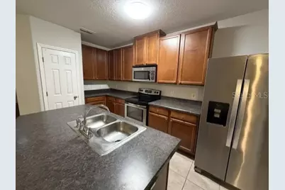 6025 NE Apollos Corner Way, Orlando, FL 32829 - Photo 4