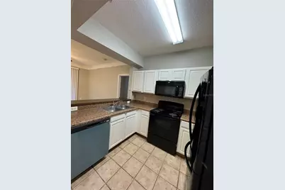 12831 Madison Pointe Circle #104, Orlando, FL 32821 - Photo 4