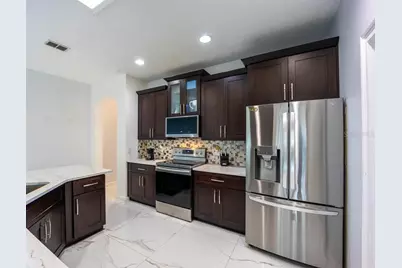 8915 Victoria Isle Place, Orlando, FL 32829 - Photo 12