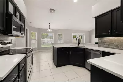 7918 Lakeside Woods Drive, Orlando, FL 32810 - Photo 10
