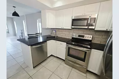 1735 Cupecoy Circle #L-1, Lutz, FL 33558 - Photo 2