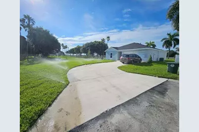 136 Dabou Loop, Belle Glade, FL 33430 - Photo 1