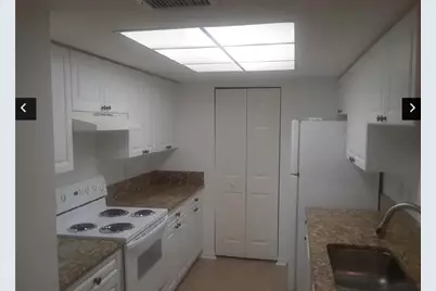 100 Crestwood Court N, Unit #104, Royal Palm Beach, FL 33411 - Photo 1