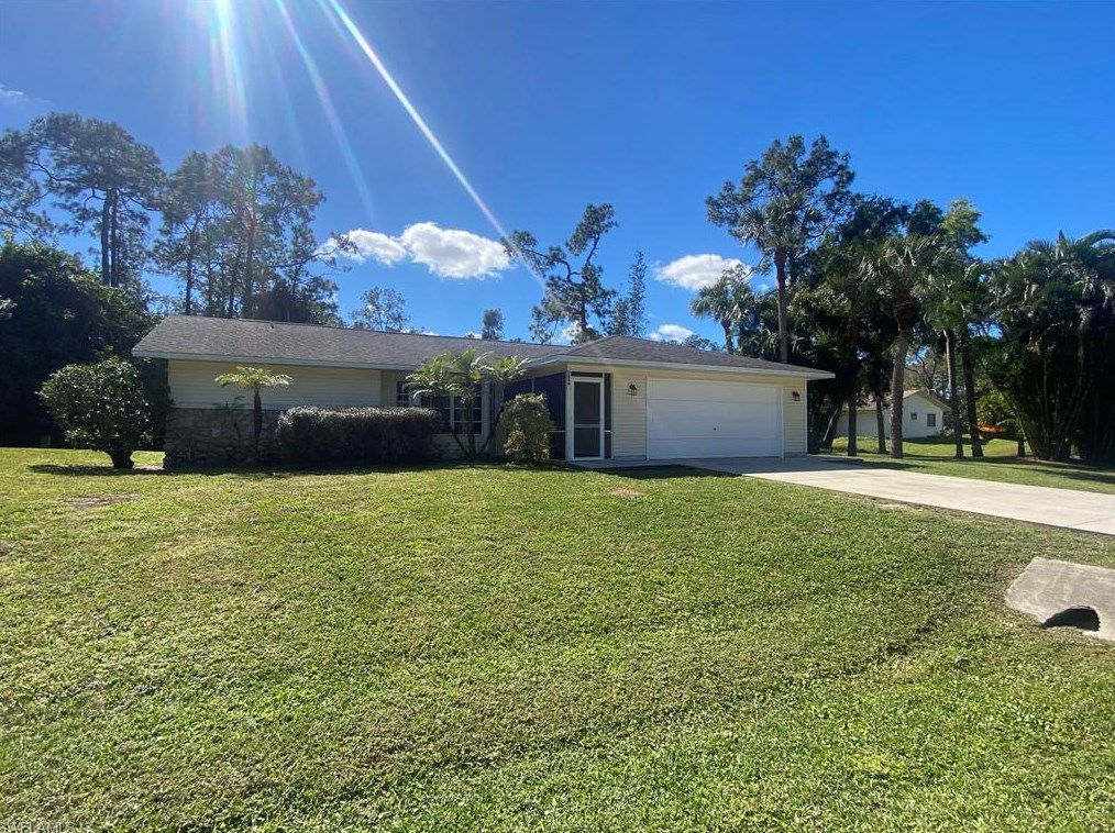 5440 Teak Wood Dr, Naples, FL 34119