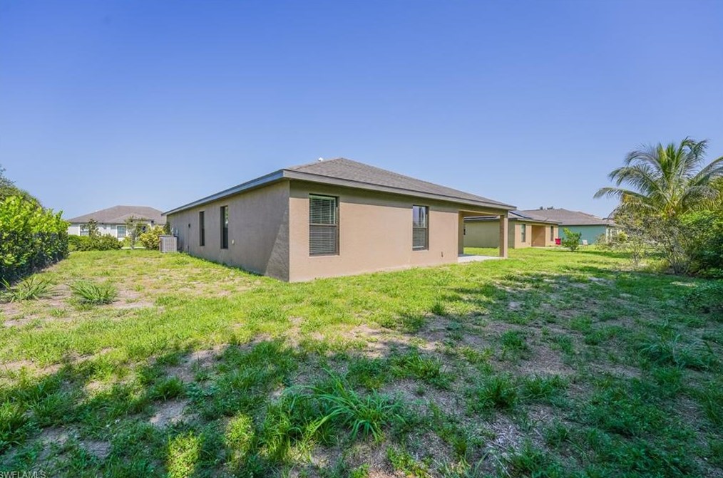 133 Shadow Lk Dr, Lehigh Acres FL 33974-0826 exterior