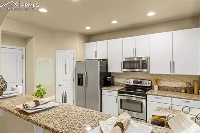 6569 Tranters Creek Way, Colorado Springs, CO 80925 - Photo 18