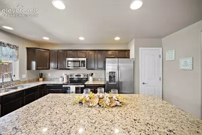 10061 Thunderbolt Trail, Colorado Springs, CO 80925 - Photo 12
