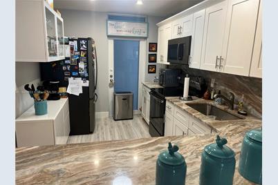 410 Golden Isles Dr #202, Hallandale Beach, FL 33009 - Photo 8