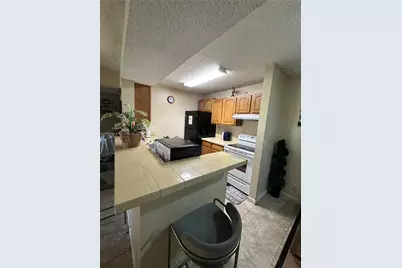 4025 W McNab Rd #E208, Pompano Beach, FL 33069 - Photo 2