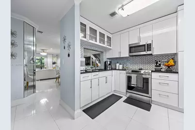 10942 W Sample Rd #E1, Coral Springs, FL 33065 - Photo 14