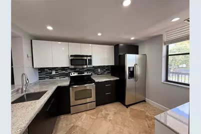 2767 S Carambola Cir S #201, Coconut Creek, FL 33066 - Photo 1