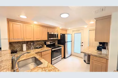 3090 N Course Dr #304, Pompano Beach, FL 33069 - Photo 2