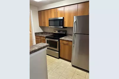 5840 W Sample Rd #306, Coral Springs, FL 33067 - Photo 6