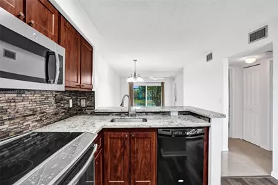 2220 N Cypress Bend Dr #310, Pompano Beach, FL 33069 - Photo 10