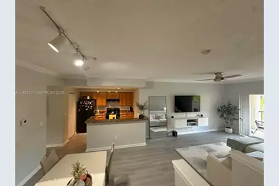 5840 W Sample Rd #305, Coral Springs, FL 33067 - Photo 8