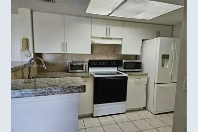 5011 Wiles Rd #306, Coconut Creek, FL 33073 - Photo 4