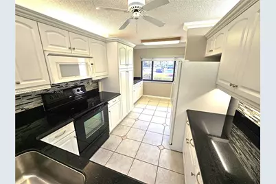 10722 W Clairmont Cir #102, Tamarac, FL 33321 - Photo 12