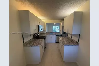 2071 Coral Ridge Dr #N204, Coral Springs, FL 33071 - Photo 2