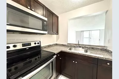 484 NW 165th St Rd #A-411, Miami, FL 33169 - Photo 1