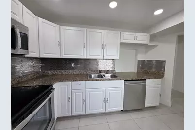 1351 NE 191st St #E420, Miami, FL 33179 - Photo 24