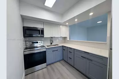 455 Golden Isles Dr #203, Hallandale Beach, FL 33009 - Photo 4