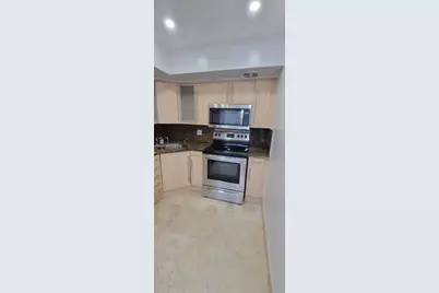 455 Golden Isles Dr #310, Hallandale Beach, FL 33009 - Photo 8