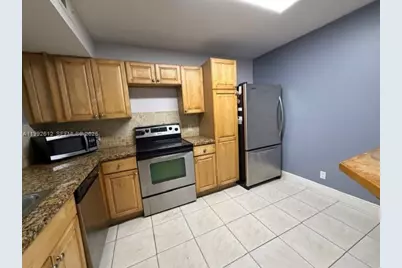 8901 Wiles Rd #103, Coral Springs, FL 33067 - Photo 2