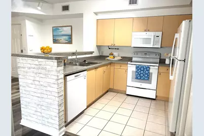 8050 N Nob Hill Rd #105, Tamarac, FL 33321 - Photo 6