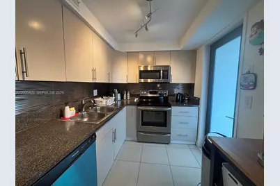 301 Golden Isles Dr #409, Hallandale Beach, FL 33009 - Photo 6