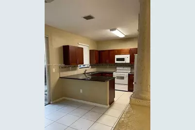 6970 NW 177th St #M104, Hialeah, FL 33015 - Photo 2