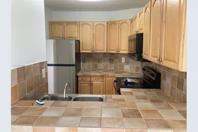6995 NW 186th St #E403, Hialeah, FL 33015 - Photo 14